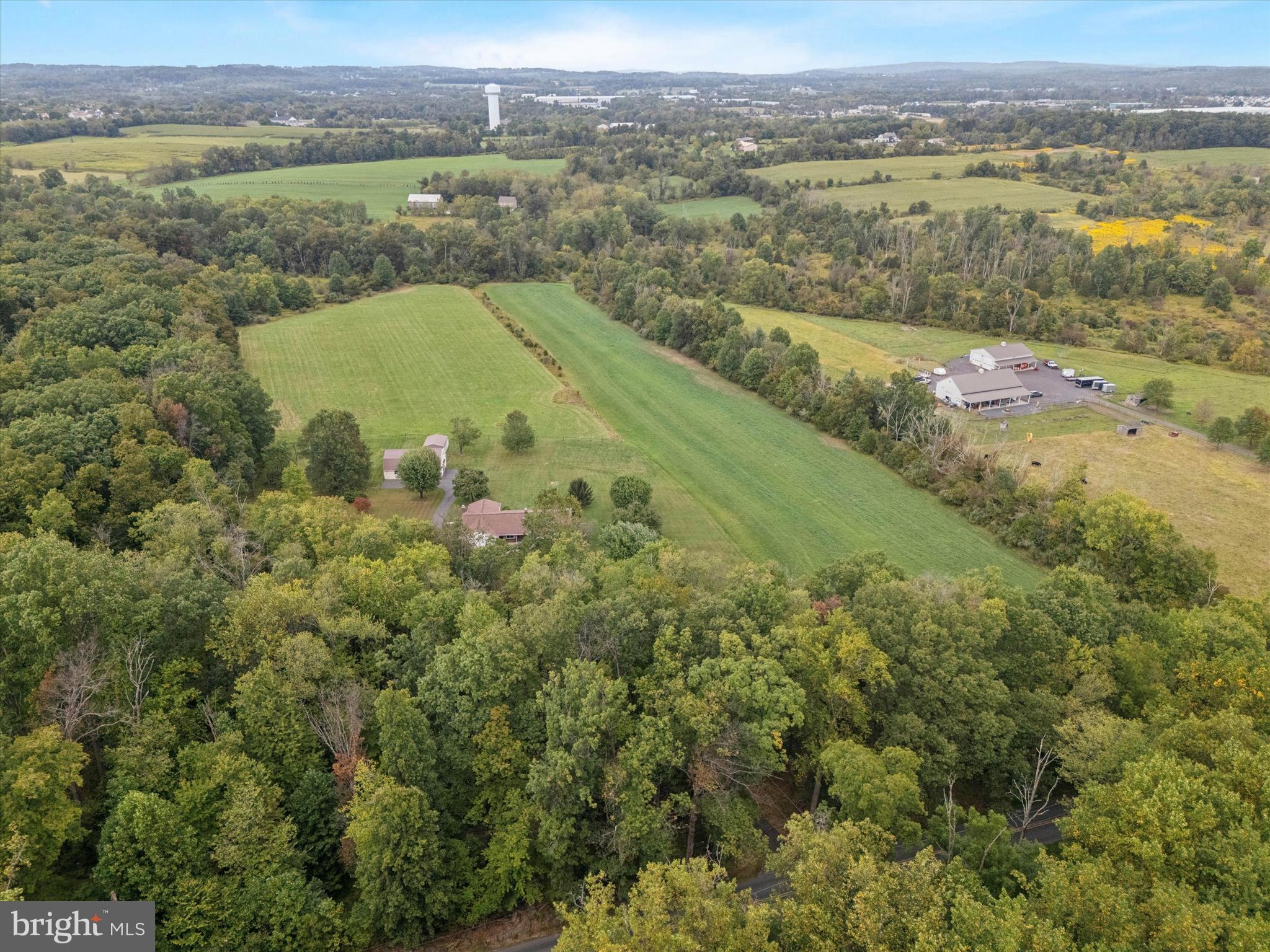 1690 Kumry Road Quakertown, PA 18951 - Photo 32 of 34 an aerial view of a houses with a lake