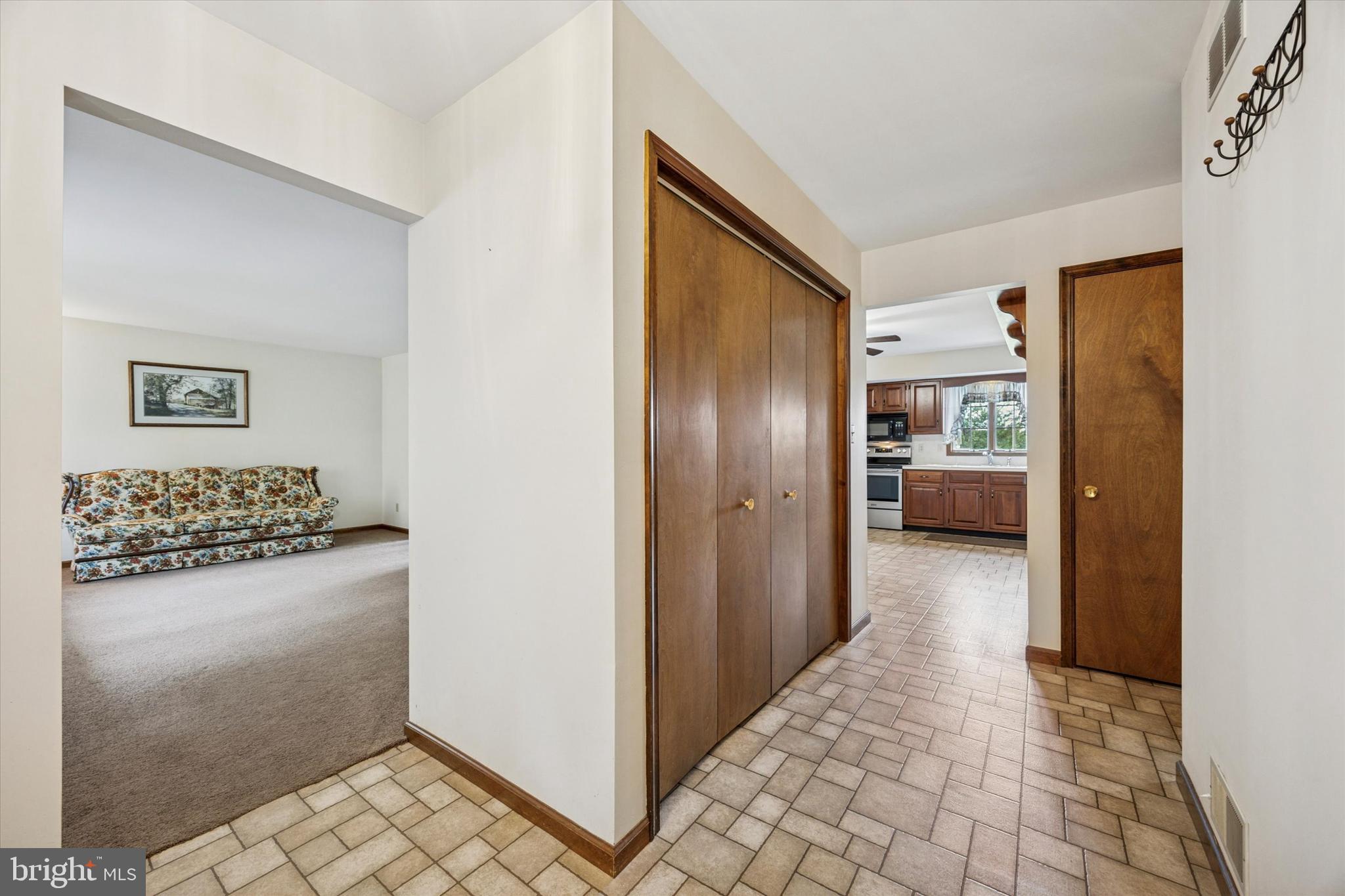 1690 Kumry Road Quakertown, PA 18951 - Photo 6 of 34 a view of a hallway with a livingroom and a bathroom