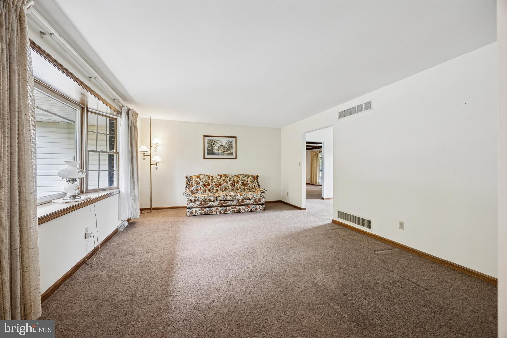 1690 Kumry Road Quakertown, PA 18951 - Photo 7 of 34 a spacious bedroom with a bed and a large window
