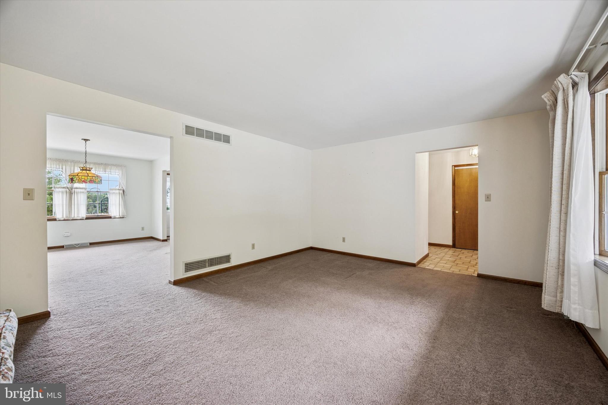 1690 Kumry Road Quakertown, PA 18951 - Photo 8 of 34 an empty room with entrance and windows