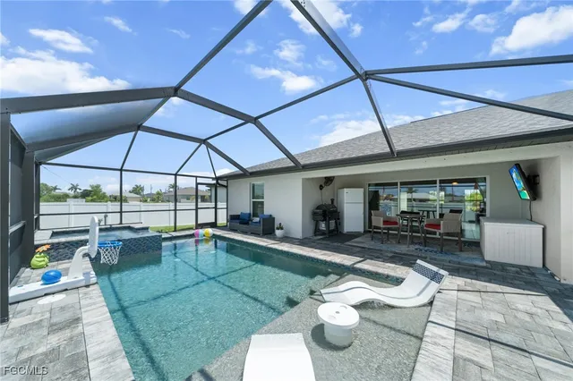 a view of a swimming pool with a patio