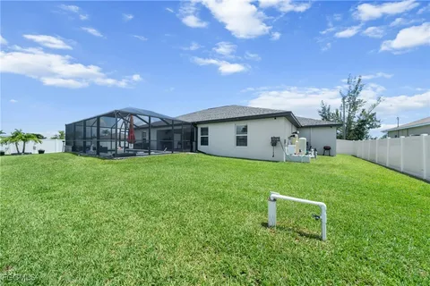 a view of a house with a yard porch and sitting area