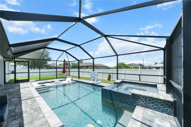 a view of a swimming pool with a patio