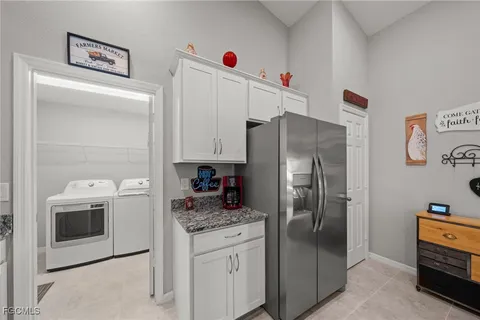 a kitchen with stainless steel appliances a refrigerator sink and stove