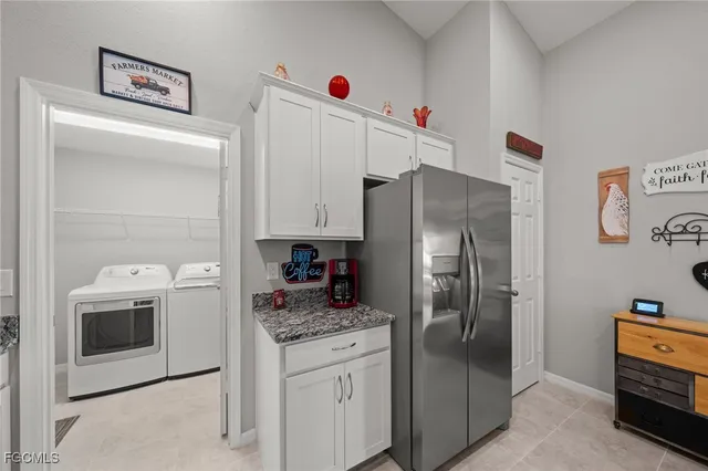 a kitchen with stainless steel appliances a refrigerator sink and stove
