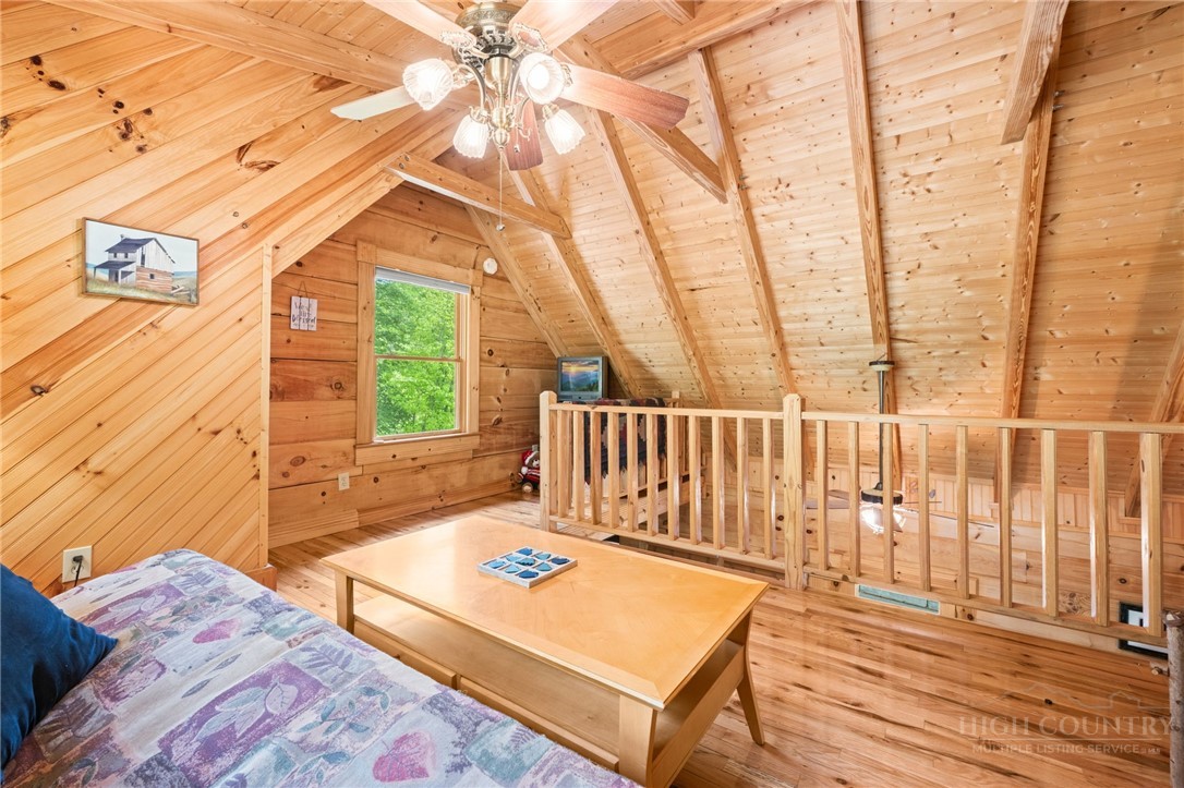 613 Silas Creek Road Lansing, NC 28643 - Photo 20 of 40 a view of a balcony with furniture and wooden floor