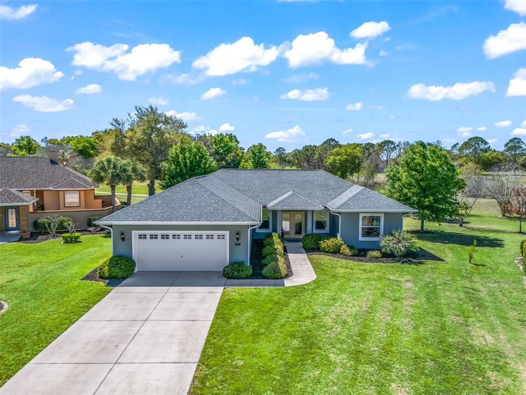 1410 Meadow View Way Lady Lake, FL 32159 - Photo 1 of 1 a view of house with garden