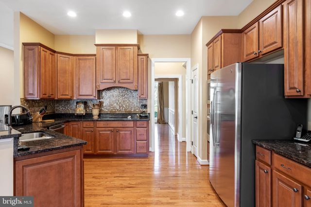a view of a livingroom with furniture and a window
