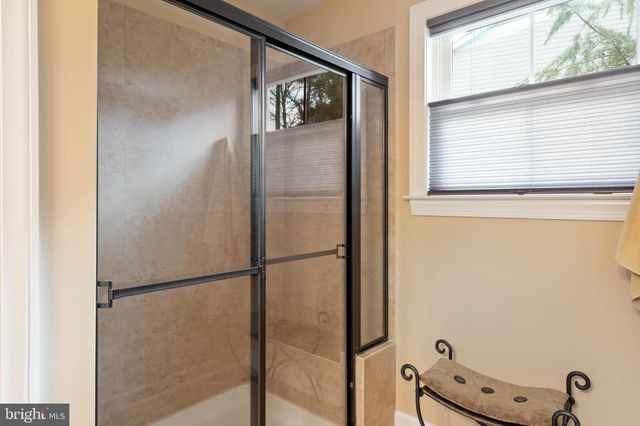 a front view of a house with outdoor seating