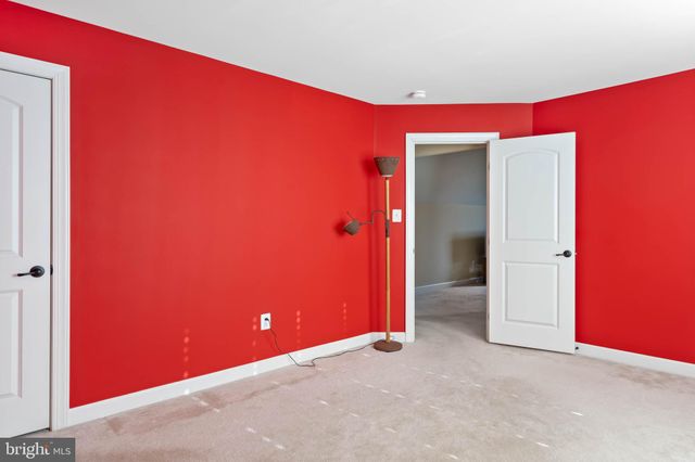 a front view of a house with a yard table and chairs