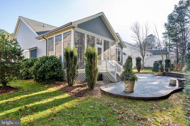 a living room with fireplace furniture and a fireplace