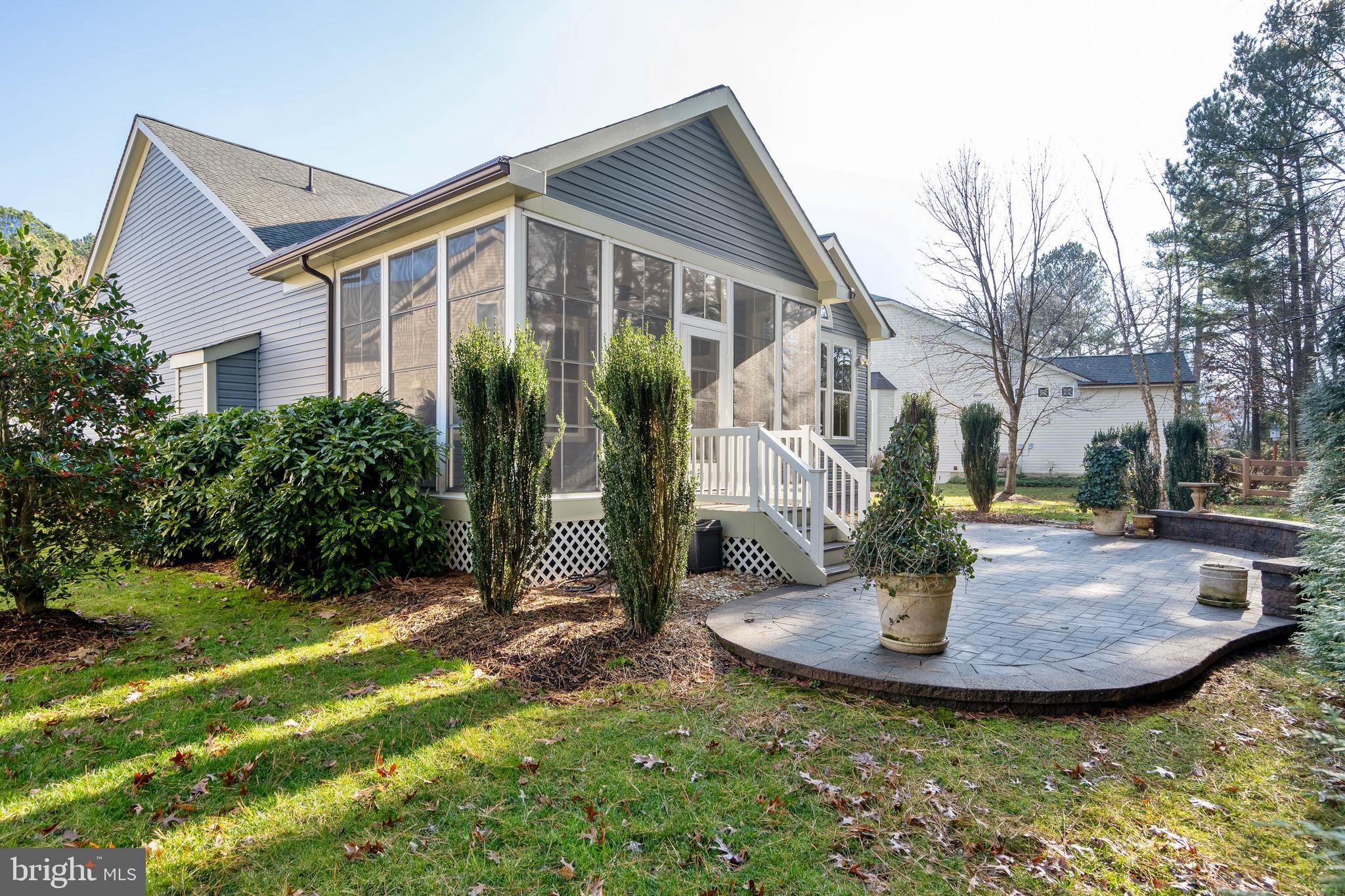 31047 Scissorbill Road Ocean View, DE 19970 - Photo 35 of 79 Beautiful Free Form Paver Patio with Sitting Wall