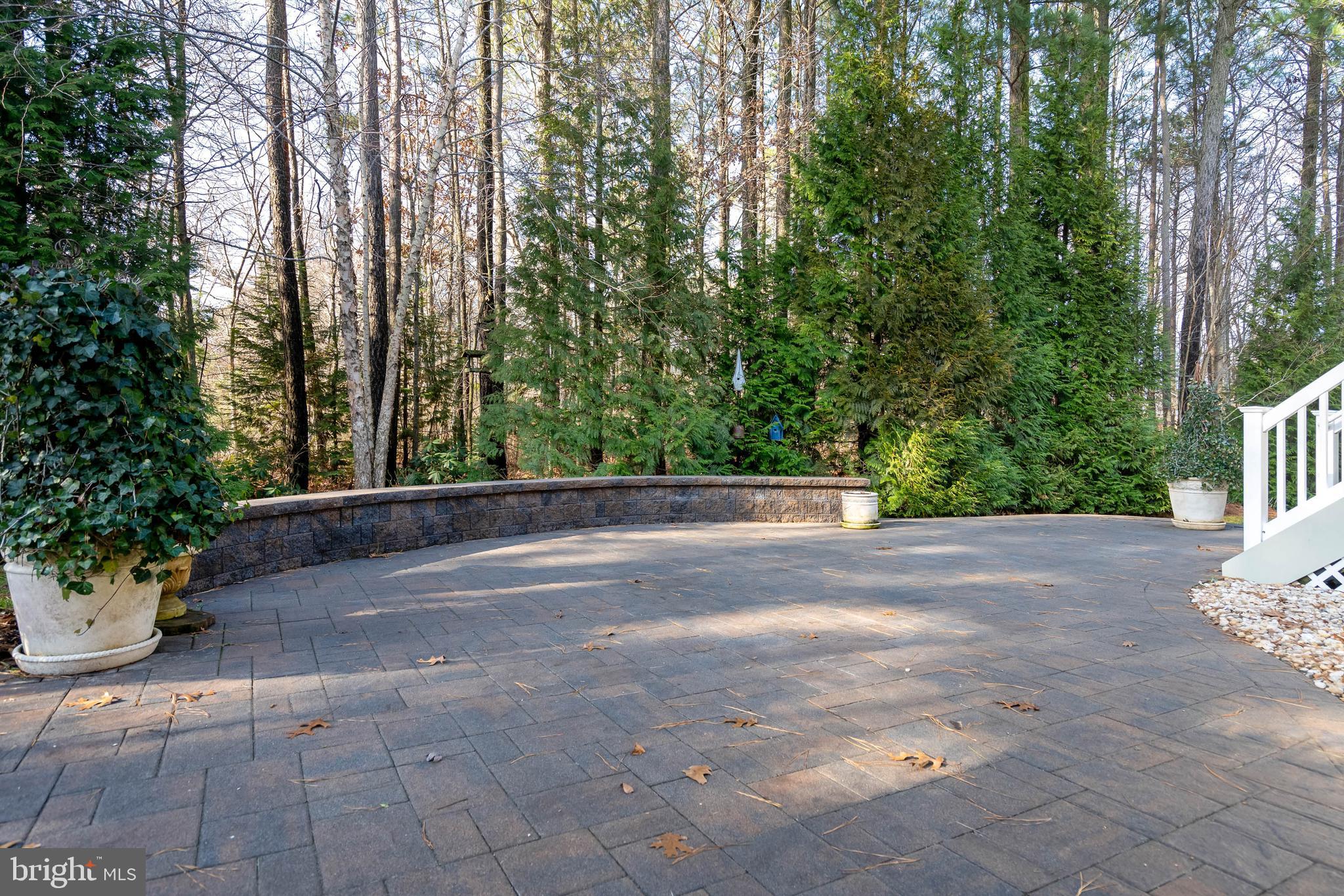 31047 Scissorbill Road Ocean View, DE 19970 - Photo 40 of 79 Beautiful Free Form Paver Patio with Sitting Wall