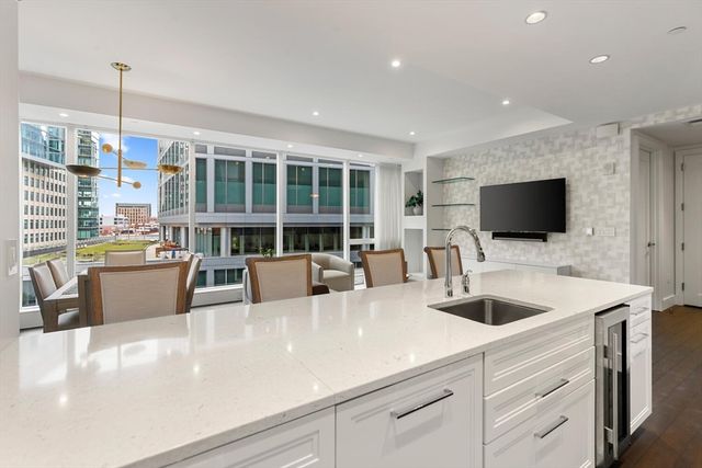 a living room with furniture and flat screen tv