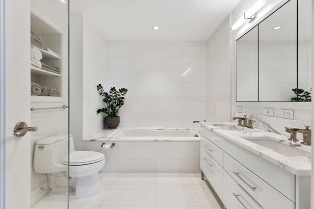 a bathroom with a sink a toilet and a bathtub