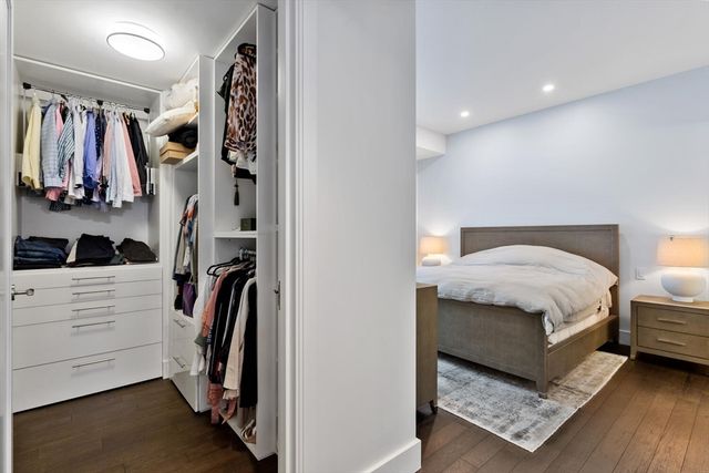 a bedroom with a bed and a walk in closet