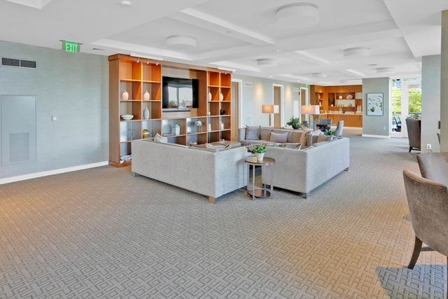 a view of a chair and tables front of the house
