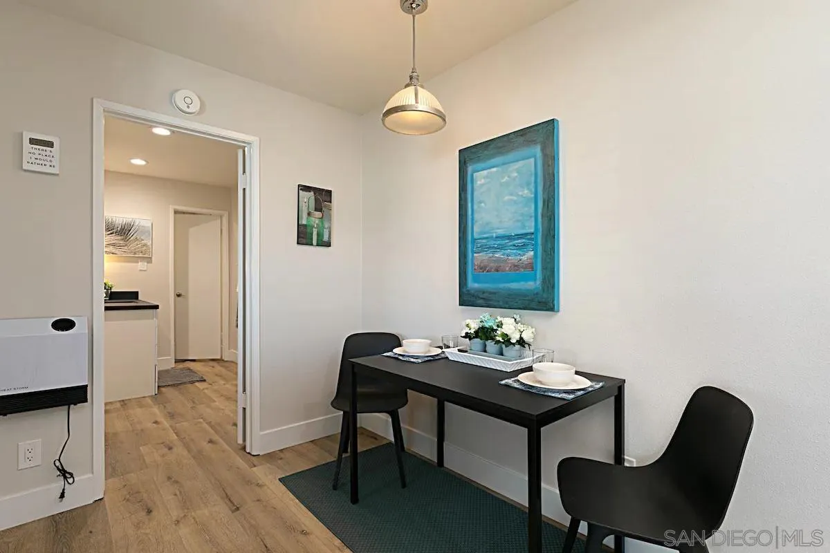 1202 North Pacific Street, Unit 106B Oceanside, CA 92054 - Photo 11 of 17 a dining room with furniture and window