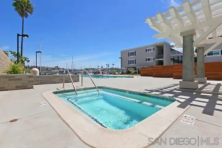 1202 North Pacific Street, Unit 106B Oceanside, CA 92054 - Photo 14 of 17 a view of a house with a swimming pool
