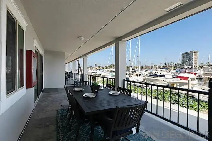 1202 North Pacific Street, Unit 106B Oceanside, CA 92054 - Photo 16 of 17 a view of a dining room with furniture window and outside view