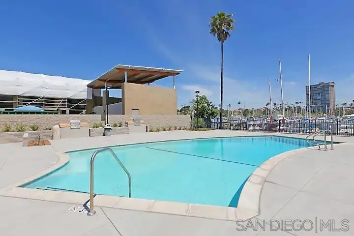 1202 North Pacific Street, Unit 106B Oceanside, CA 92054 - Photo 10 of 17 a kitchen with a sink and a microwave
