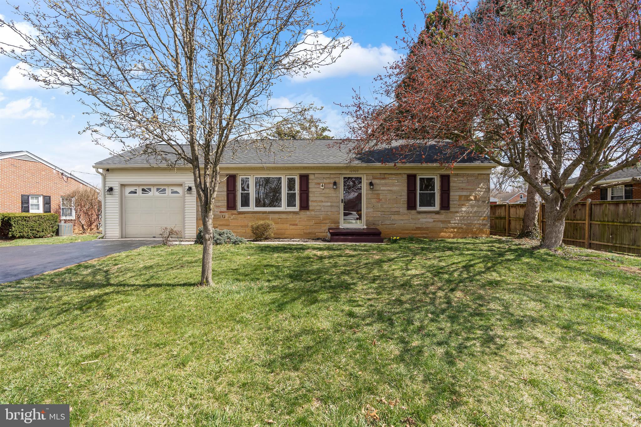 a house that has a tree in front of it