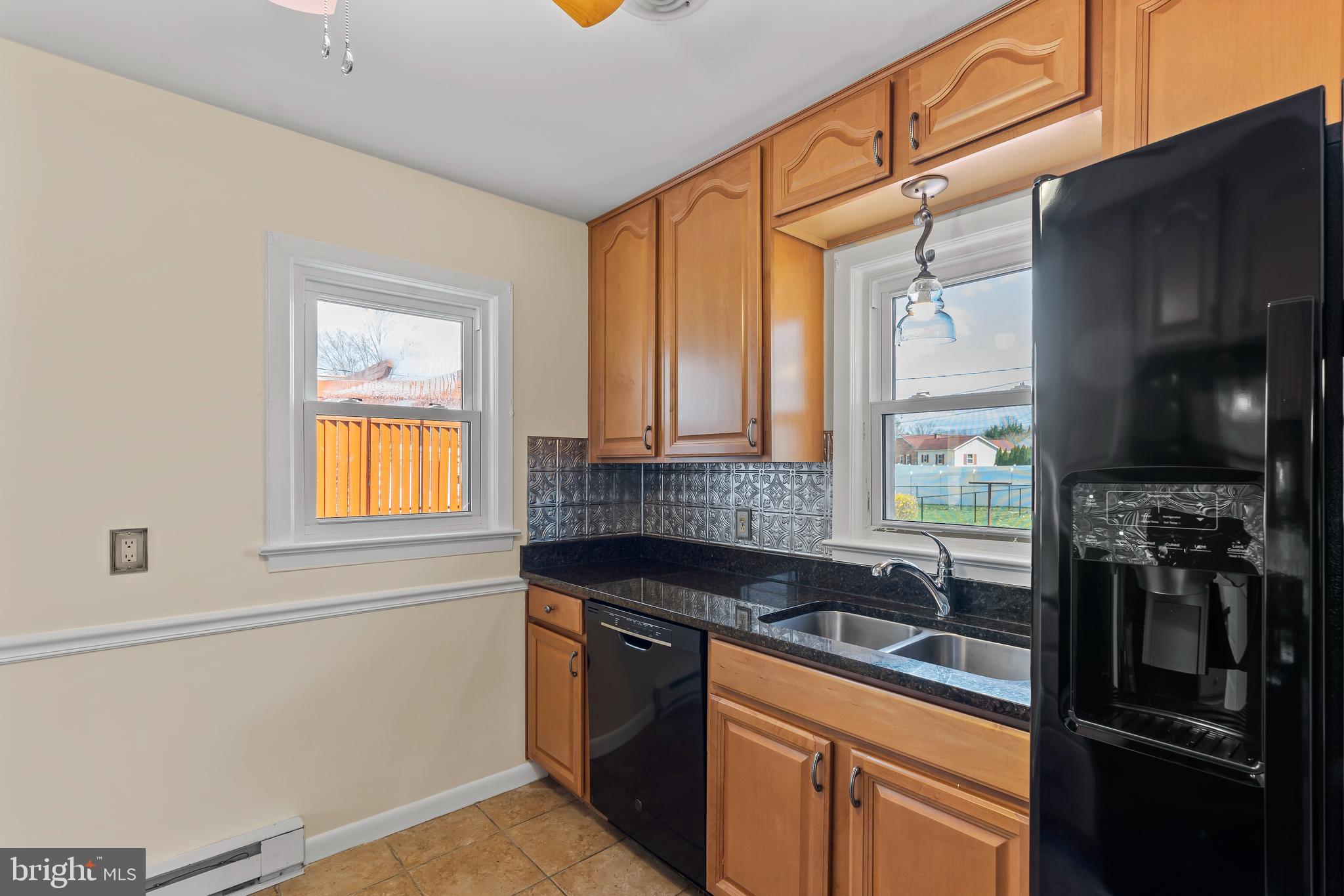 10909 Donelson Drive Williamsport, MD 21795 - Photo 12 of 37 a kitchen with a sink appliances cabinets and a window