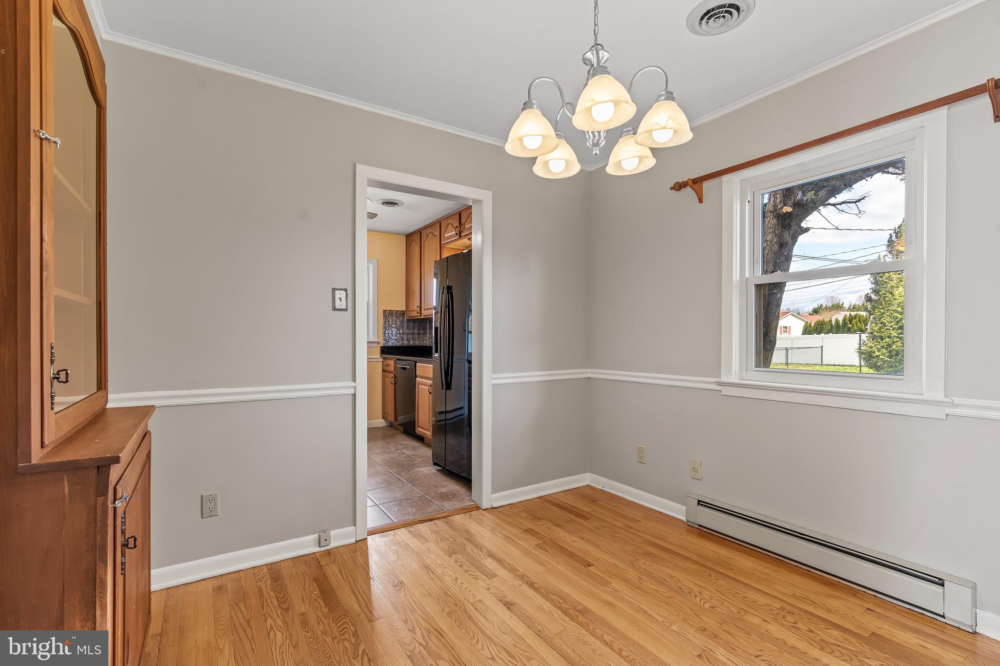 10909 Donelson Drive Williamsport, MD 21795 - Photo 14 of 37 wooden floor in an empty room with a window
