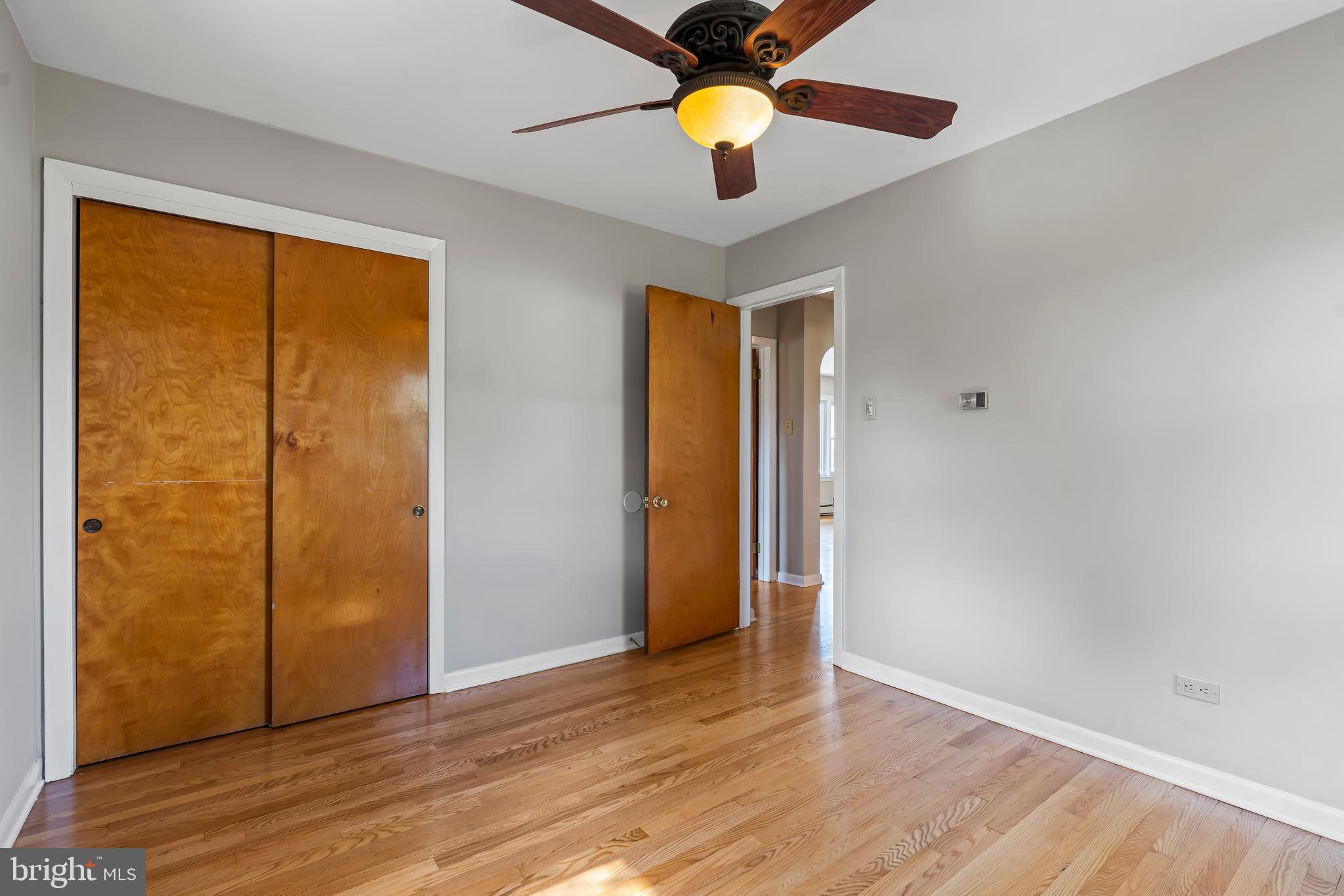 10909 Donelson Drive Williamsport, MD 21795 - Photo 19 of 37 a view of an empty room with wooden floor and a window