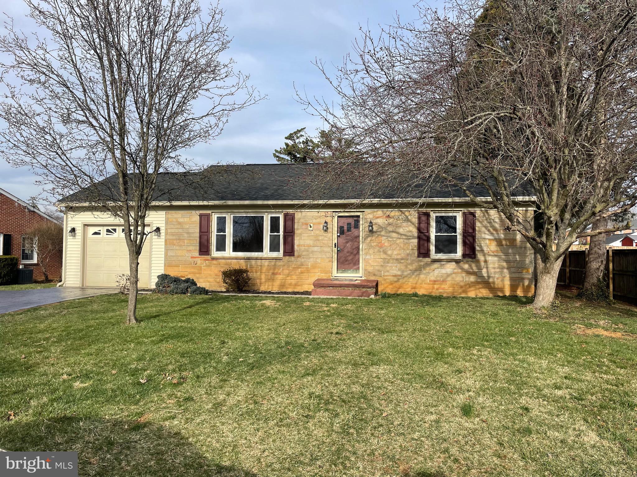 10909 Donelson Drive Williamsport, MD 21795 - Photo 35 of 37 a front view of a house with a garden