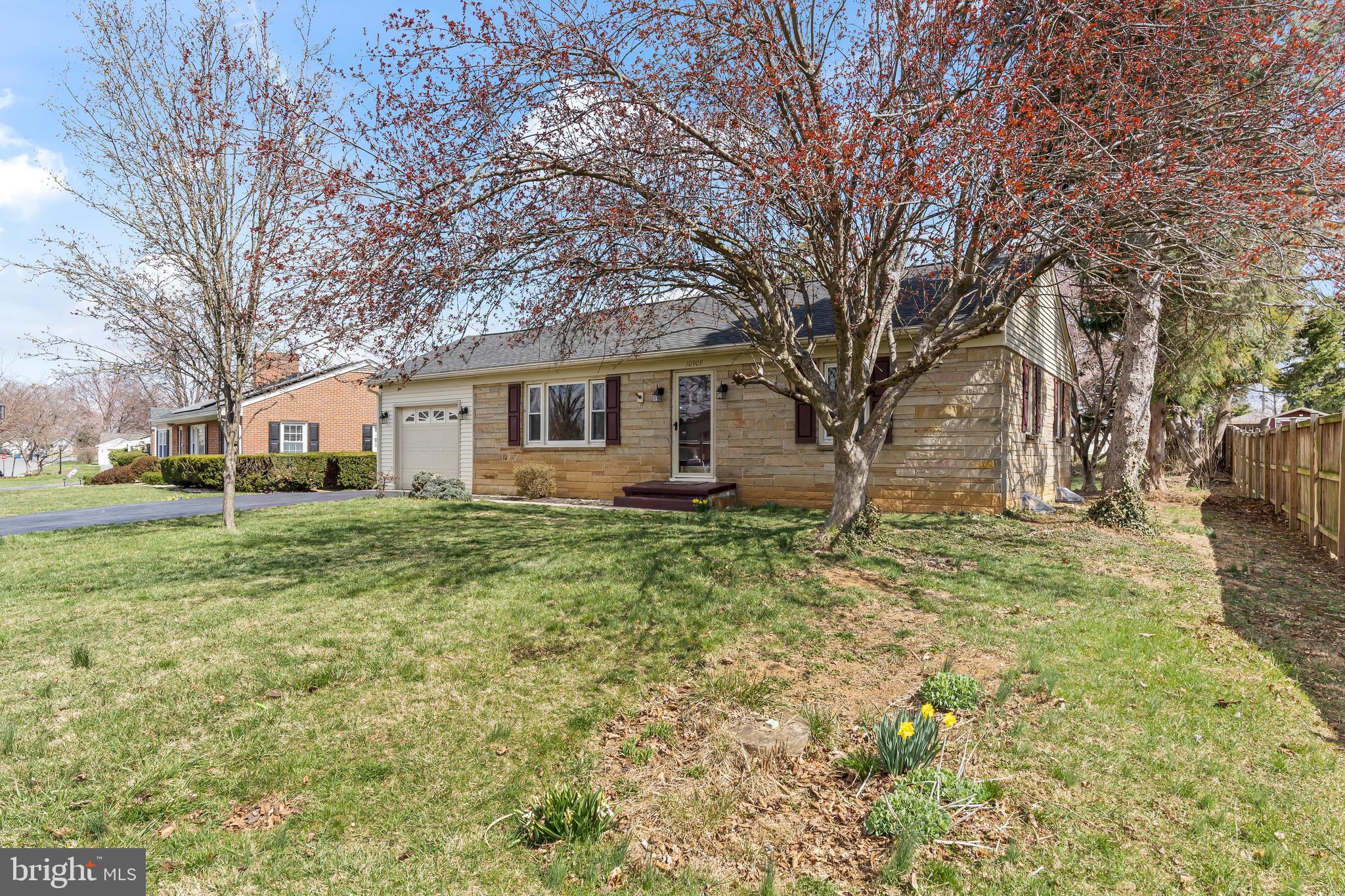 10909 Donelson Drive Williamsport, MD 21795 - Photo 5 of 37 a view of a yard in front of a house with large trees