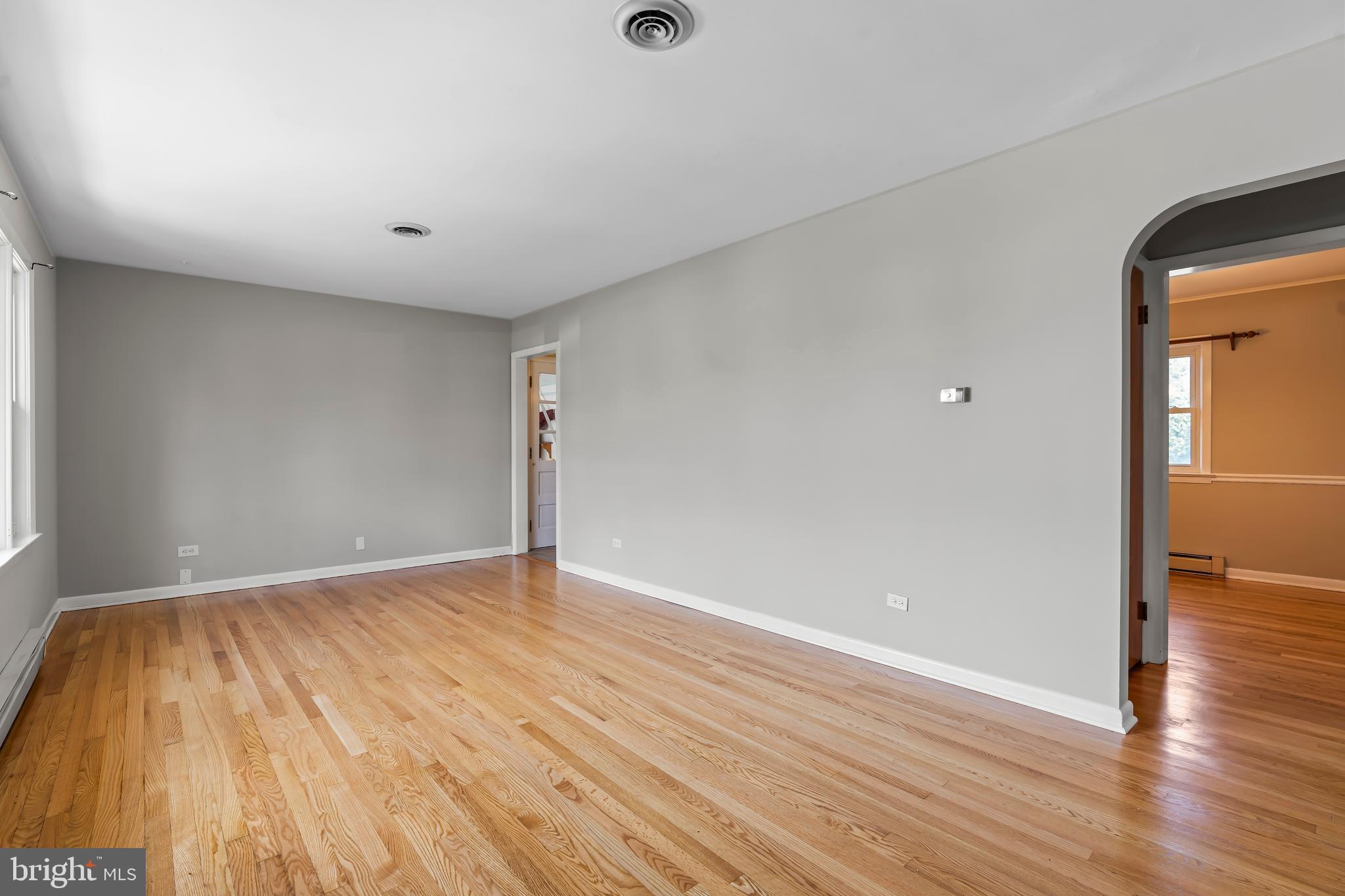 10909 Donelson Drive Williamsport, MD 21795 - Photo 8 of 37 an empty room with wooden floor and windows