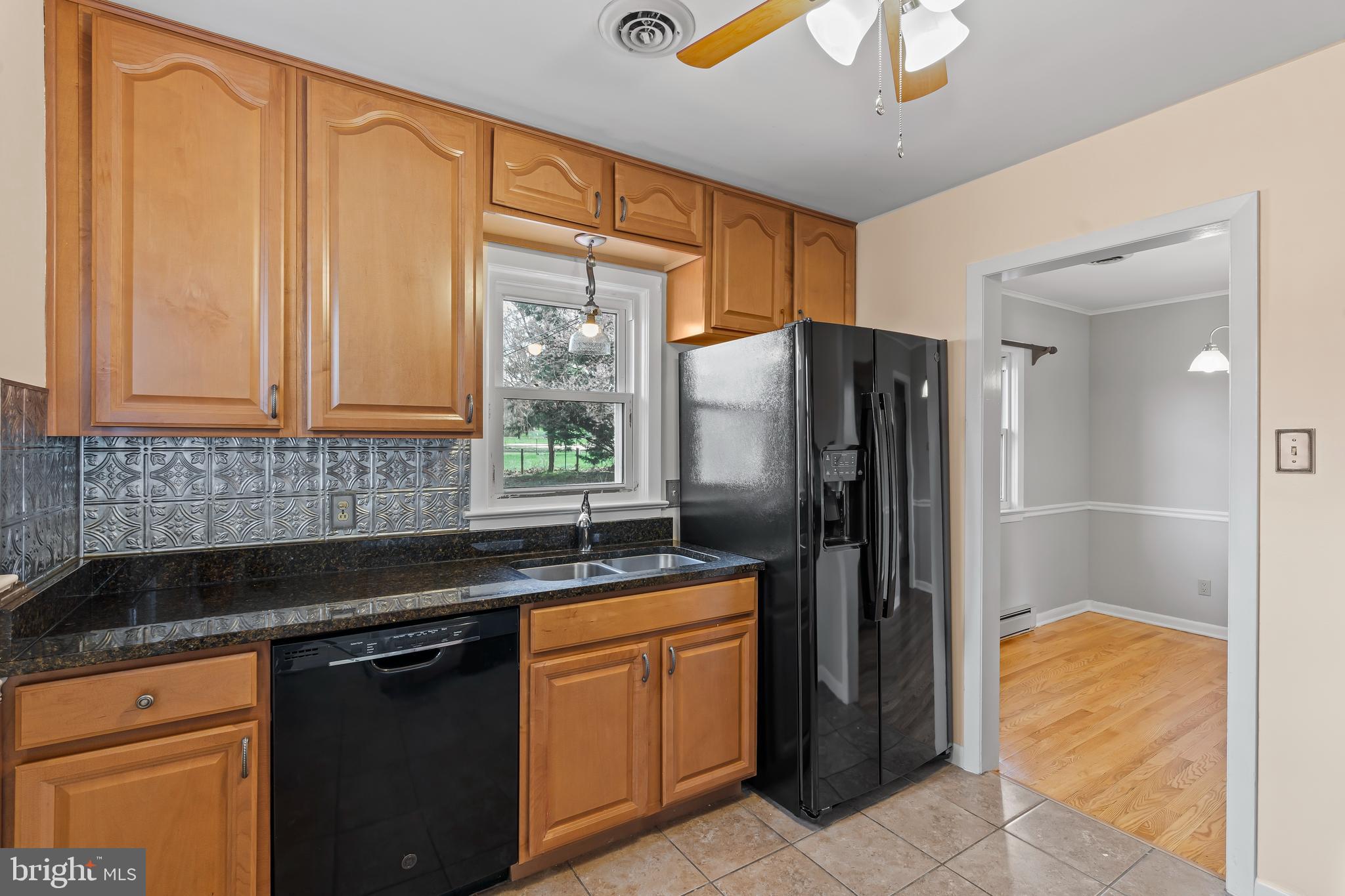 10909 Donelson Drive Williamsport, MD 21795 - Photo 10 of 37 a kitchen with stainless steel appliances granite countertop a refrigerator and a sink