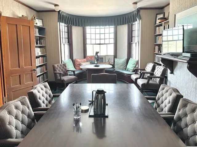 a living room with furniture window and wooden floor