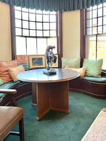 a dining room with a table and chairs