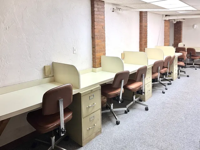 a workspace with furniture and a window