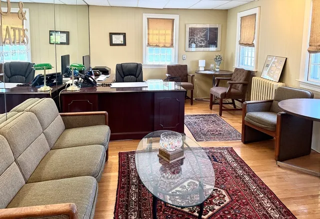 a living room with furniture or couch and a large window