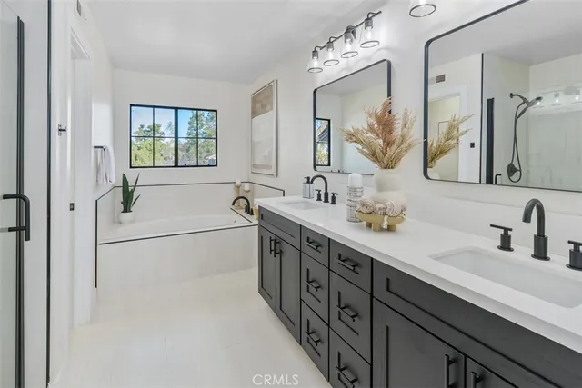 a bathroom with a bath tub and shower