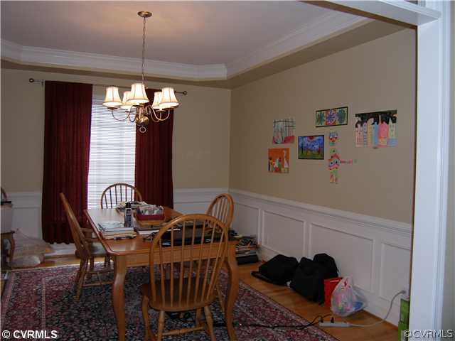 913 Biggin Pond Road Midlothian, VA 23114 - Photo 8 of 24 a dining room with furniture and chandelier kitchen view