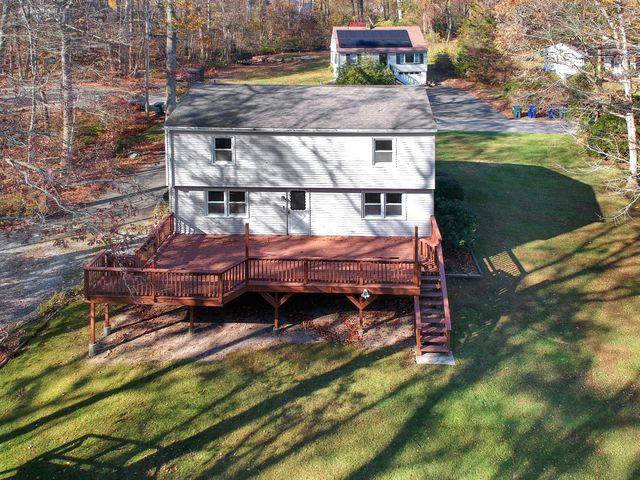 a view of swimming pool with outdoor seating and yard