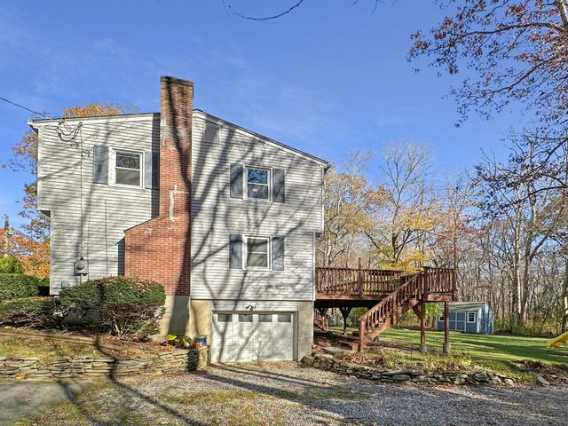 an aerial view of residential house with an outdoor space and street view