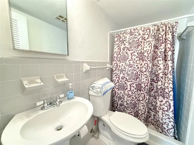 a view of a livingroom with furniture and wooden floor