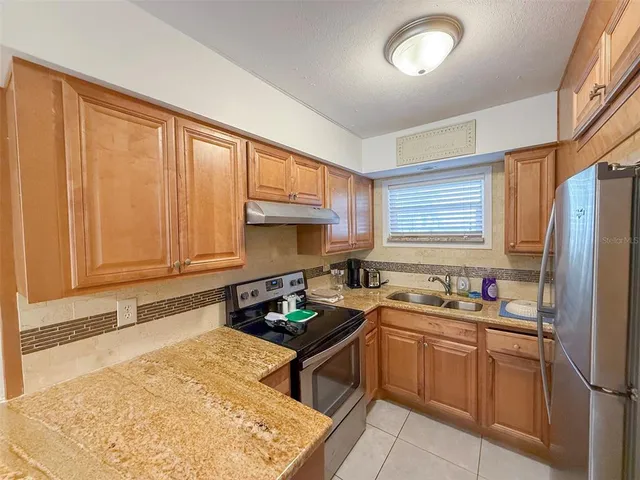 a living room with furniture a table and chairs