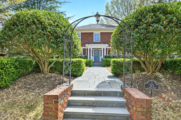 front view of a house with a garden