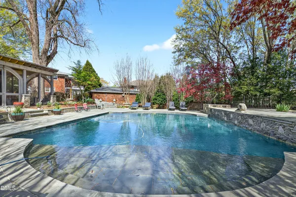 a view of a swimming pool with a patio
