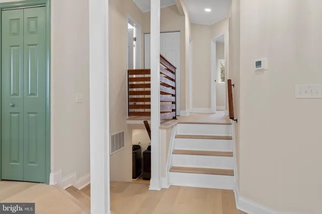 a view of staircase with white walls