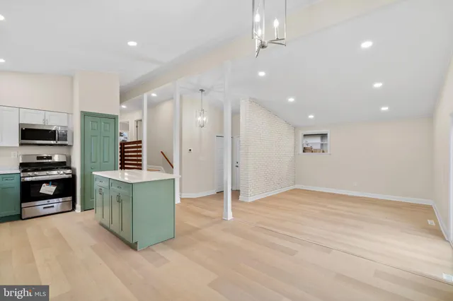 a kitchen with refrigerator cabinets and furniture