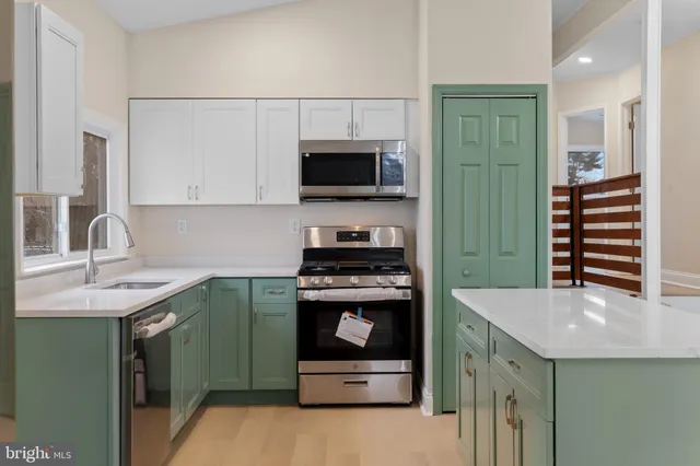 a kitchen with a refrigerator and a sink