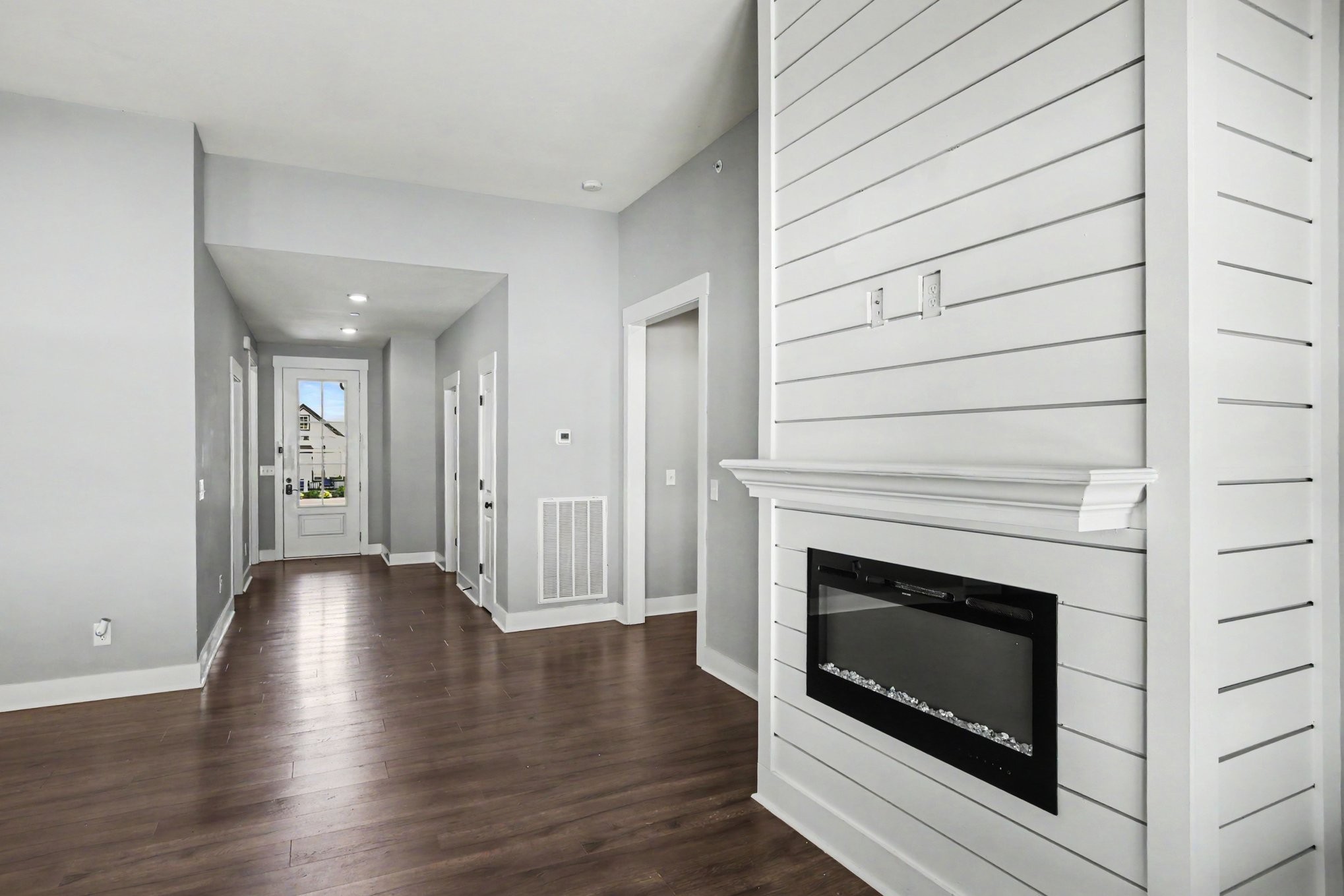 7208 Winding Way Pleasant View, TN 37146 - Photo 3 of 30 a view of a livingroom with wooden floor and a fireplace