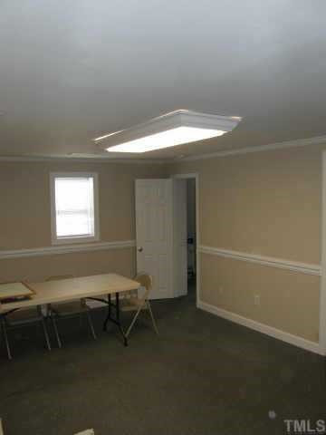 219 Gilbert Avenue Raleigh, NC 27603 - Photo 6 of 12 The living room in the residence is very spacious, and has a large closet as well. This room has an exterior entrance, which maintains the privacy of the owner during business hours. Other